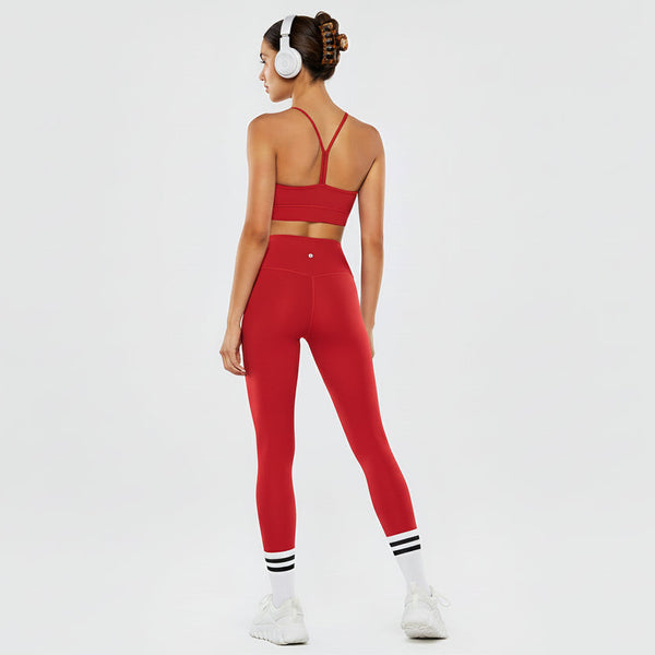 RED leggings worn by a person on a white background