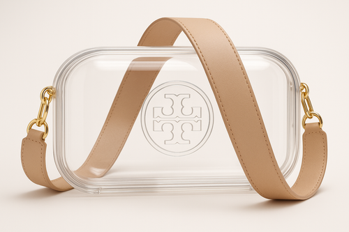 A CAPSULE SIZED CLEAR BAG LAYING HORIZONTALLY WITH THE LONG END DOWN IT HAS GOLD FASTENERS ON THE LEFT AND RIGHT AND A 2 INCH CROSS BODY STRAP IN PALE TAN LEATHER. THE LOG ON THE FRONT IS A CIRCLE CONTAINING AN UPSIDE DOWN CAPITAL T WITH A RIGHTSIZE UP CAPTIAL T THAT ARE VERTICALLY STACKED